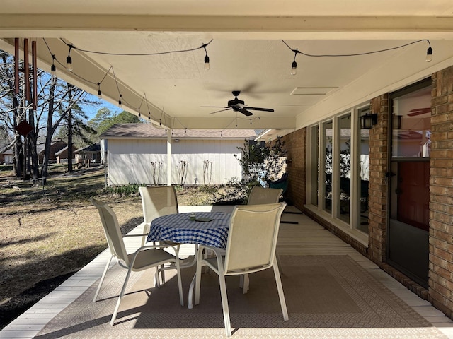 view of patio / terrace with outdoor dining space and a ceiling fan