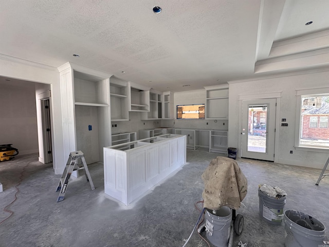 kitchen featuring a textured ceiling and a center island