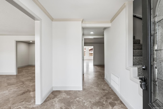 hallway featuring crown molding, stairway, baseboards, and visible vents