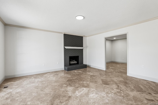 unfurnished living room featuring crown molding, a brick fireplace, baseboards, and visible vents