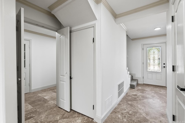 foyer entrance featuring stairs, stone finish flooring, visible vents, and ornamental molding