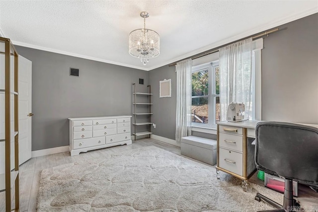 office area with baseboards, a textured ceiling, crown molding, and light wood finished floors