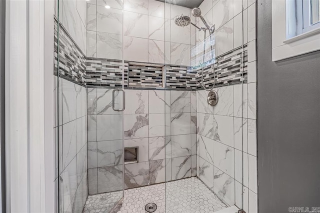 bathroom with a shower stall