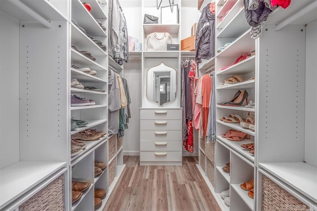 walk in closet featuring light wood-type flooring