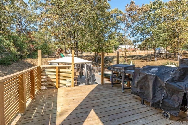 wooden terrace with area for grilling