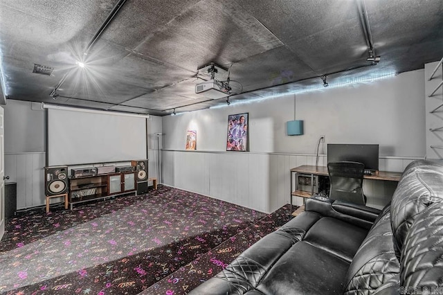 carpeted home theater with visible vents and wainscoting