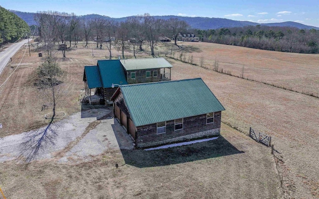 drone / aerial view featuring a rural view and a mountain view