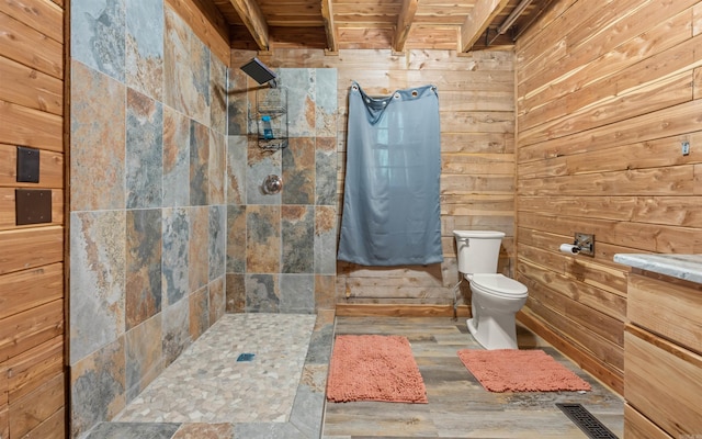 full bathroom with wood walls, toilet, walk in shower, and wood finished floors