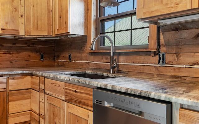 kitchen with a sink and stainless steel dishwasher