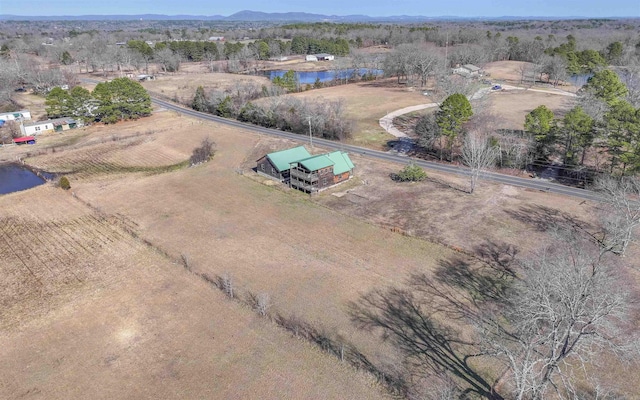 drone / aerial view featuring a rural view and a water view