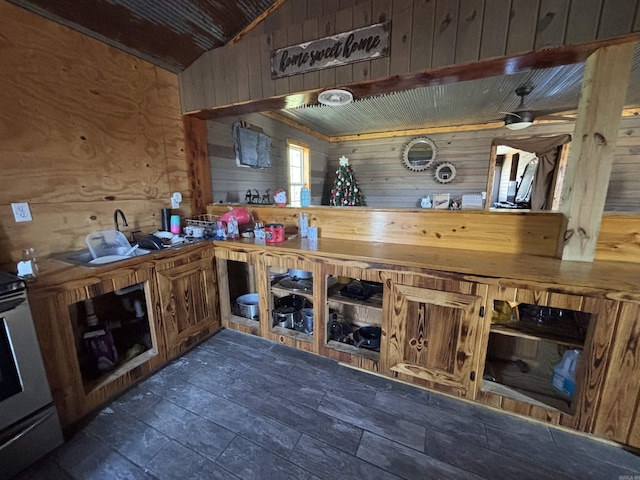 bar featuring wooden walls, dark wood finished floors, vaulted ceiling, wooden ceiling, and range