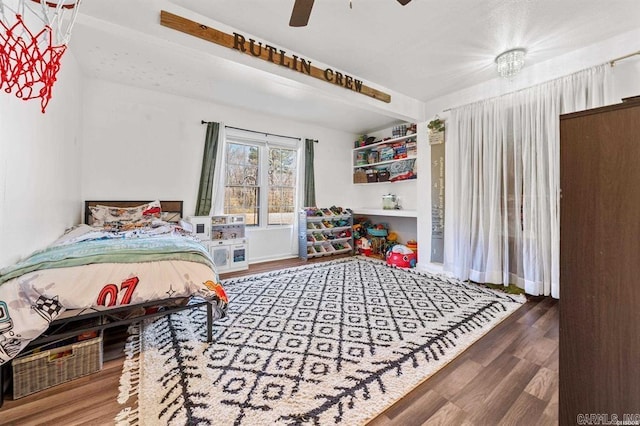 bedroom featuring ceiling fan and wood finished floors