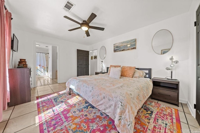 bedroom with light tile patterned floors, baseboards, visible vents, and ceiling fan