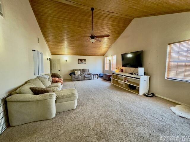 living area featuring carpet flooring, wooden ceiling, and high vaulted ceiling