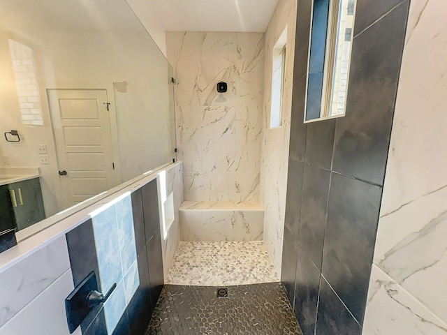 full bath with tiled shower