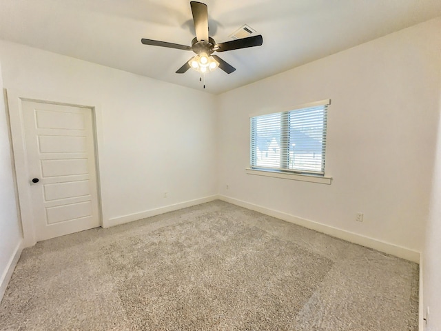 empty room featuring visible vents, ceiling fan, baseboards, and carpet floors