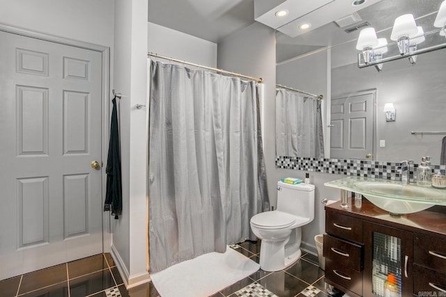 bathroom featuring tile patterned flooring, visible vents, tasteful backsplash, toilet, and vanity