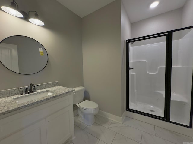 full bathroom with a shower stall, toilet, vanity, and baseboards