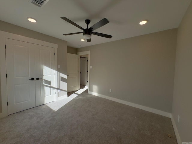 unfurnished bedroom featuring recessed lighting, visible vents, carpet flooring, and baseboards