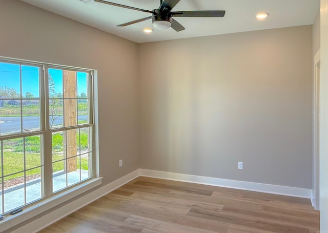 1275 Acuff Ln, Conway, AR 72034 - empty room featuring a wealth of natural light, light wood-type flooring, baseboards, and a ceiling fan