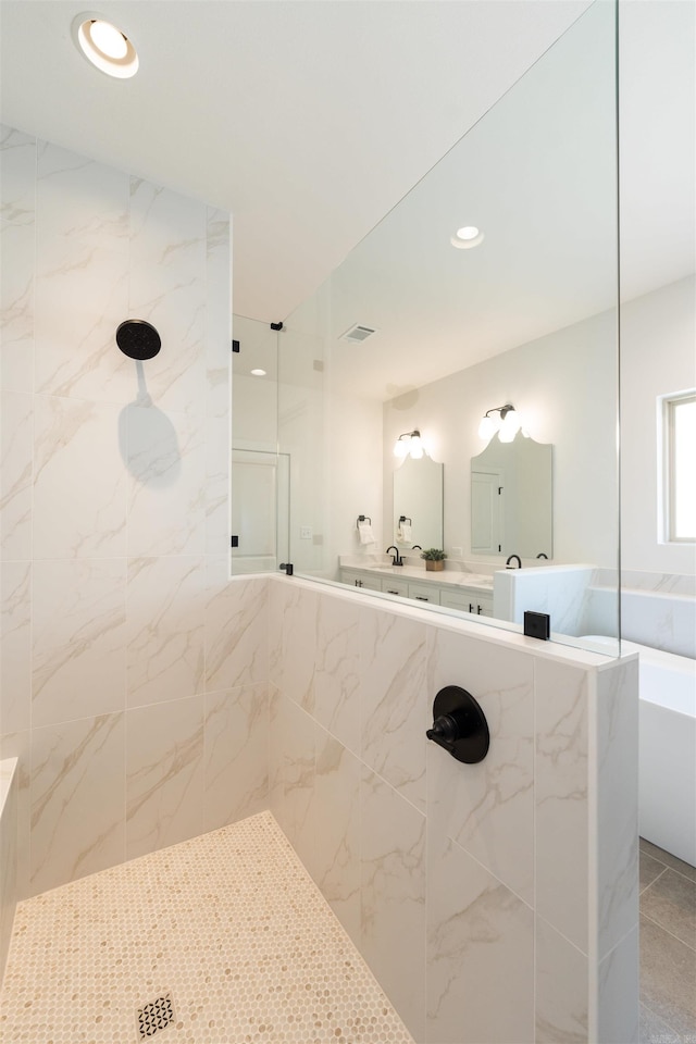 full bathroom featuring visible vents, recessed lighting, a walk in shower, and a tub to relax in