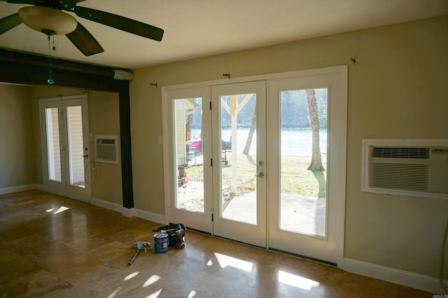 entryway with a ceiling fan, french doors, baseboards, and a wall mounted air conditioner