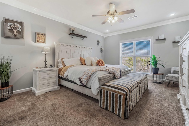 carpeted bedroom featuring visible vents, baseboards, ornamental molding, and a ceiling fan