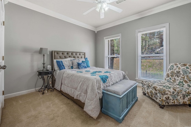 bedroom with crown molding, multiple windows, baseboards, and light carpet