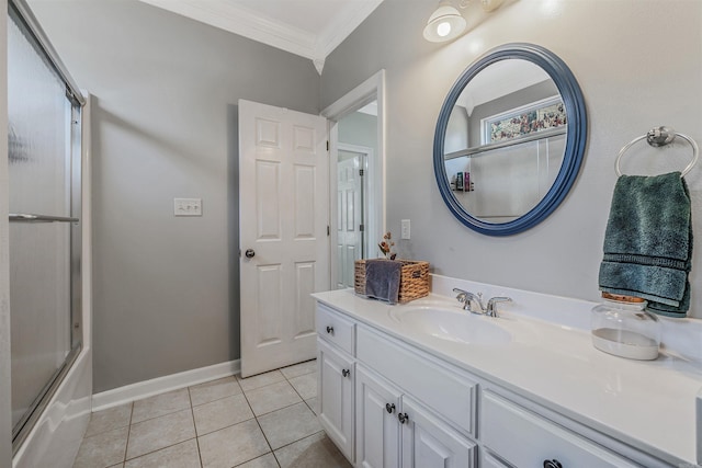 full bath featuring vanity, baseboards, shower / bath combination with glass door, crown molding, and tile patterned floors