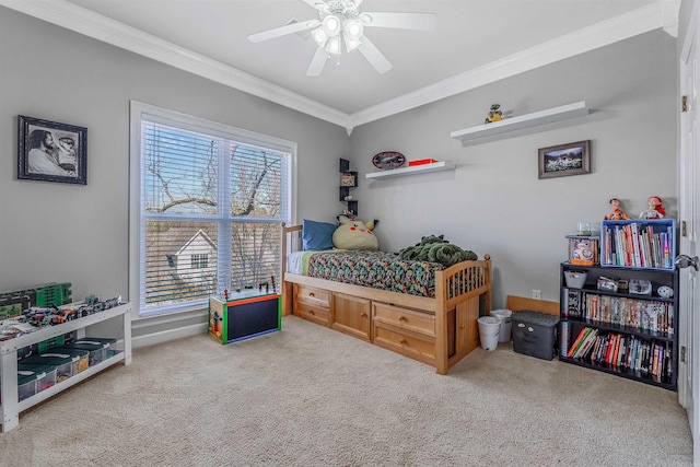 carpeted bedroom with crown molding and ceiling fan