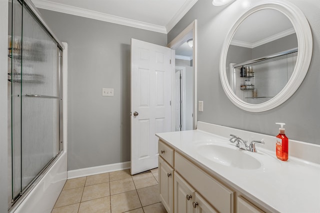 bathroom with shower / bath combination with glass door, crown molding, tile patterned flooring, baseboards, and vanity