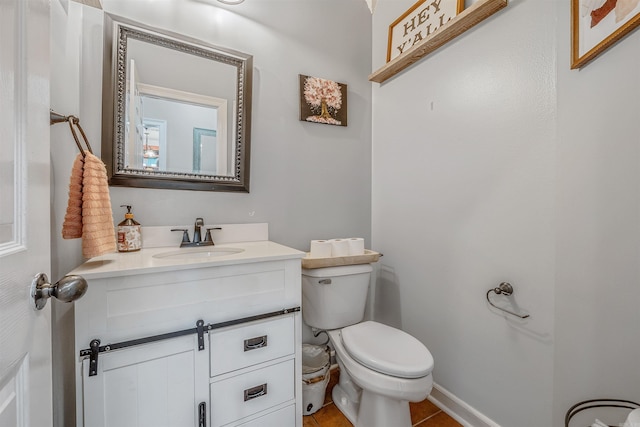 bathroom with vanity, tile patterned floors, and toilet