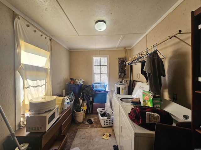 washroom featuring laundry area, washing machine and dryer, and electric water heater