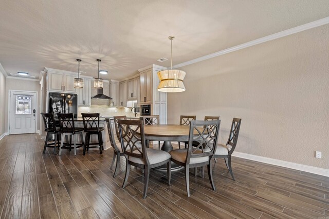 dining space with dark wood-style floors, visible vents, crown molding, and baseboards