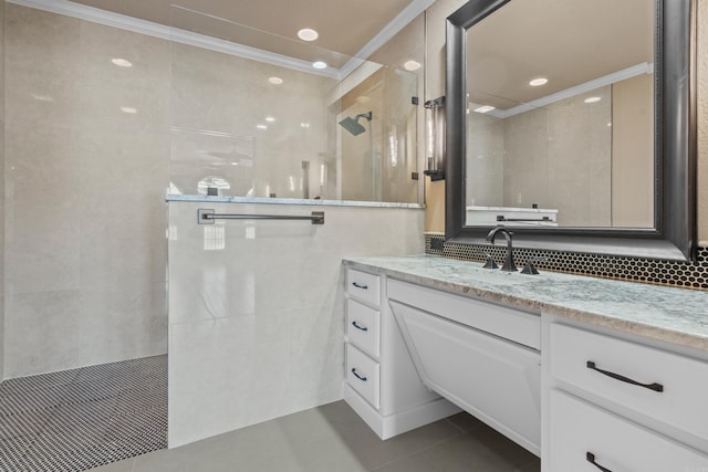 full bath featuring a walk in shower, crown molding, vanity, tile patterned floors, and tile walls