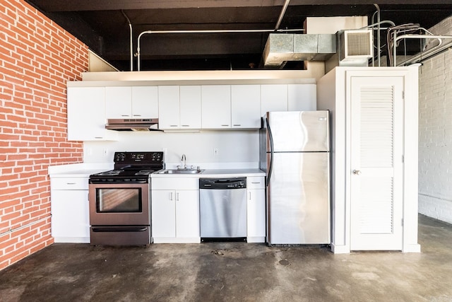 kitchen featuring brick wall, a sink, stainless steel appliances, concrete flooring, and under cabinet range hood