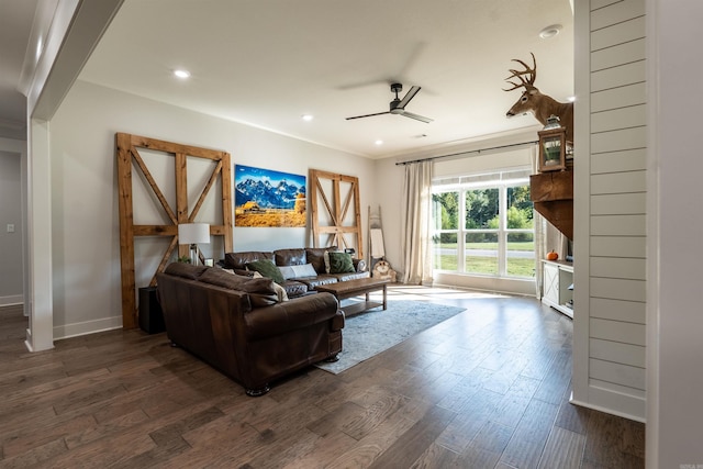 living area featuring ornamental molding, dark wood-style floors, recessed lighting, baseboards, and ceiling fan