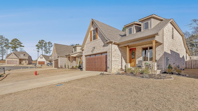 view of front of house featuring brick siding, a porch, concrete driveway, and a garage