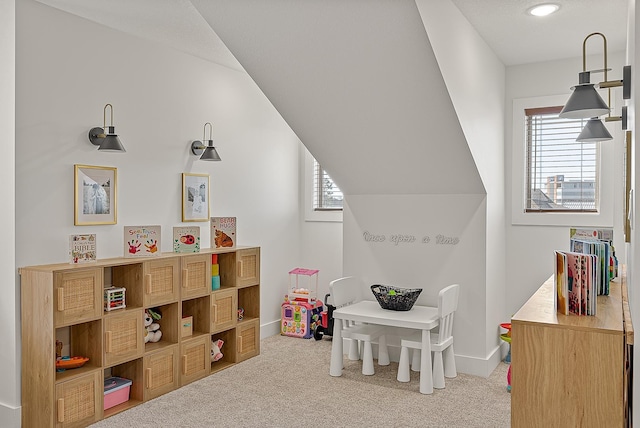 game room with baseboards, lofted ceiling, and carpet flooring