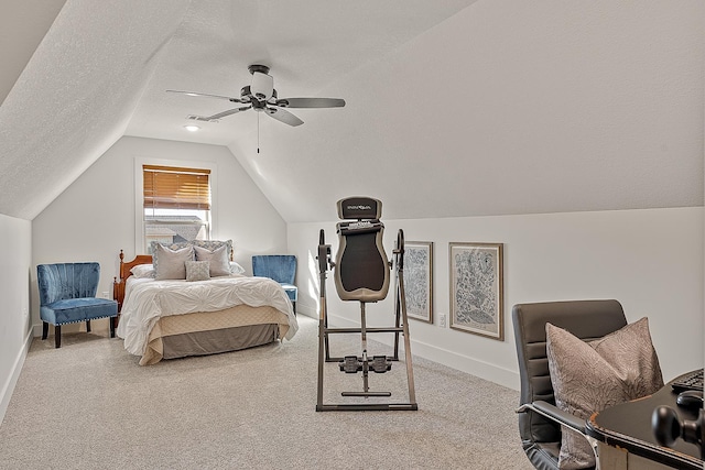 bedroom featuring vaulted ceiling, a textured ceiling, baseboards, and carpet floors