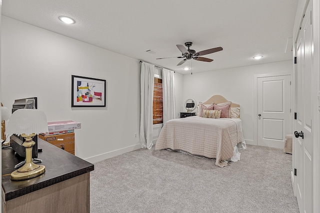 bedroom with ceiling fan, recessed lighting, baseboards, and light carpet