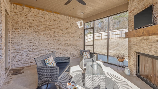 view of patio with a ceiling fan and fence