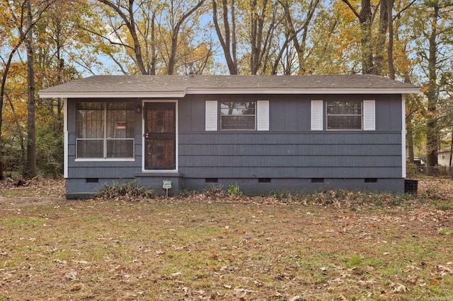 view of front of house with a front lawn, a sunroom, and crawl space