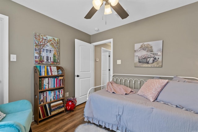 bedroom featuring a ceiling fan and wood finished floors