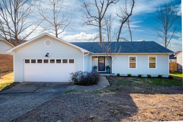 single story home featuring aphalt driveway, a garage, roof with shingles, and fence