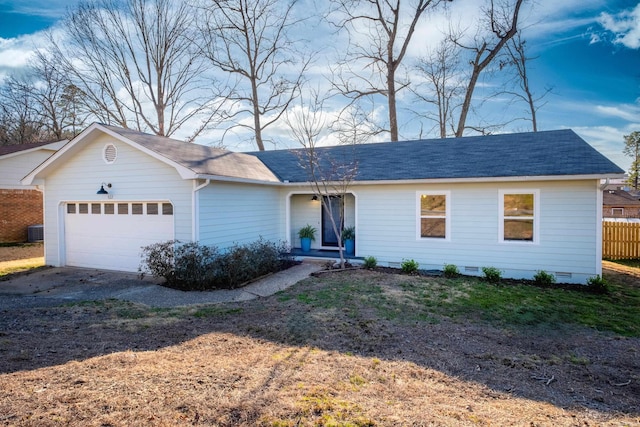 ranch-style house with a garage, driveway, fence, a shingled roof, and crawl space