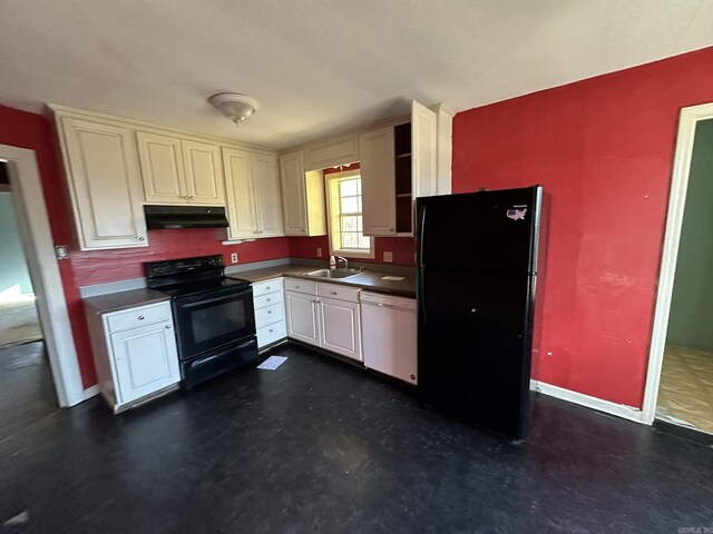 kitchen with under cabinet range hood, baseboards, dark countertops, and black appliances