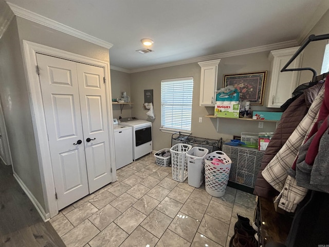 laundry area with washing machine and clothes dryer, laundry area, crown molding, and visible vents