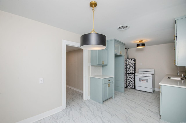 kitchen with visible vents, a sink, light countertops, white gas range oven, and marble finish floor