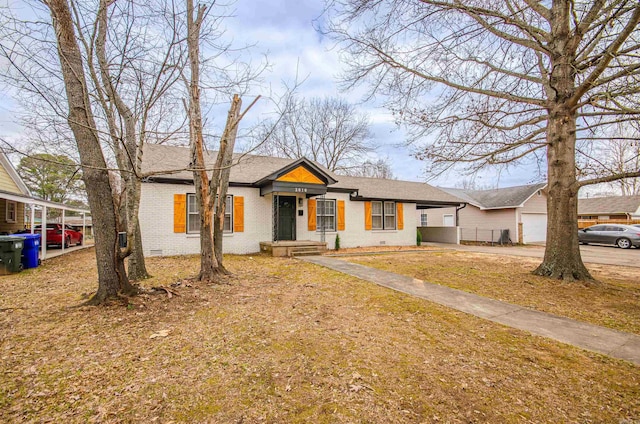 ranch-style house featuring brick siding, a shingled roof, a garage, crawl space, and driveway